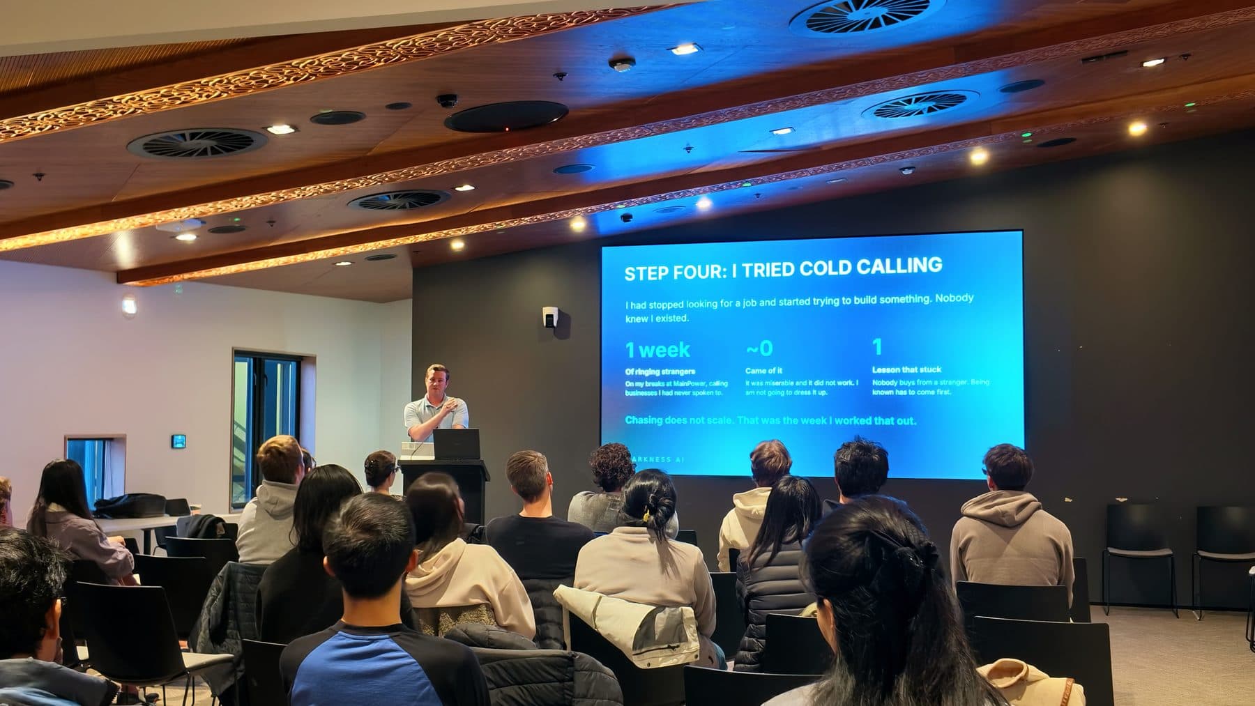 Blake Harkness presenting a slide titled "Step four: I tried cold calling" to students in a lecture room