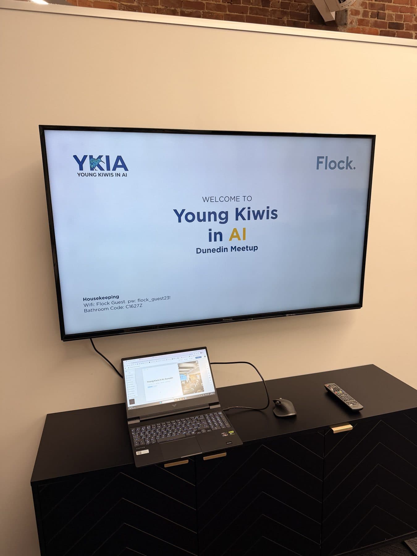 A screen welcoming attendees to the Young Kiwis in AI Dunedin meetup at Flock Consulting
