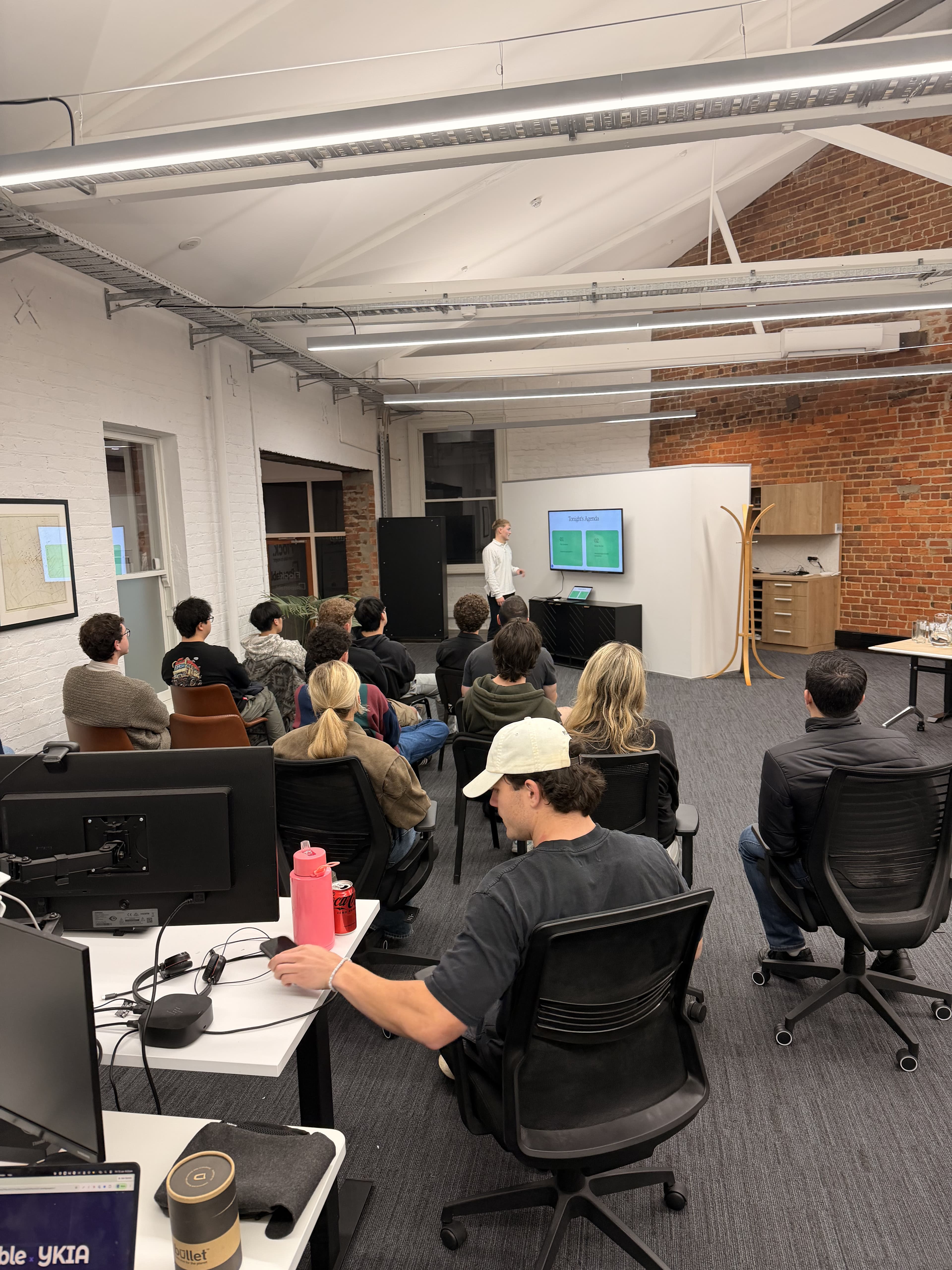 Audience watching a presentation at the Young Kiwis in AI Dunedin meetup
