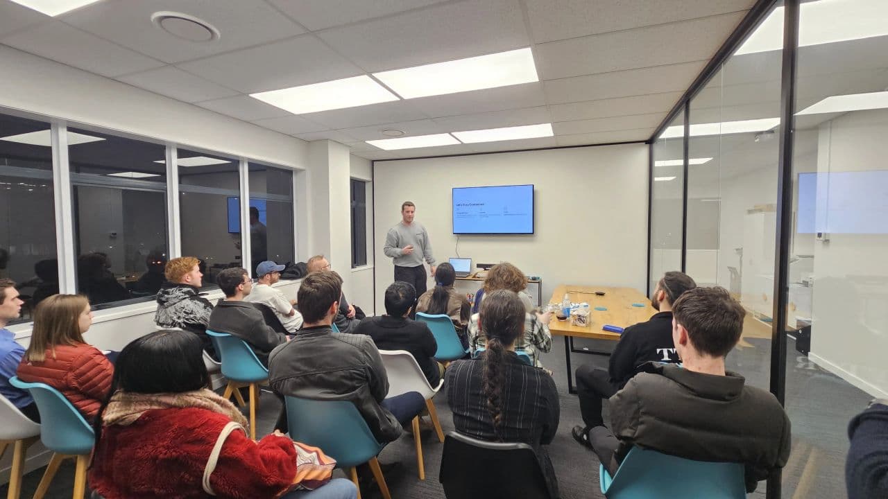 Blake Harkness presenting to a full room at the Young Kiwis in AI Palmerston North meetup