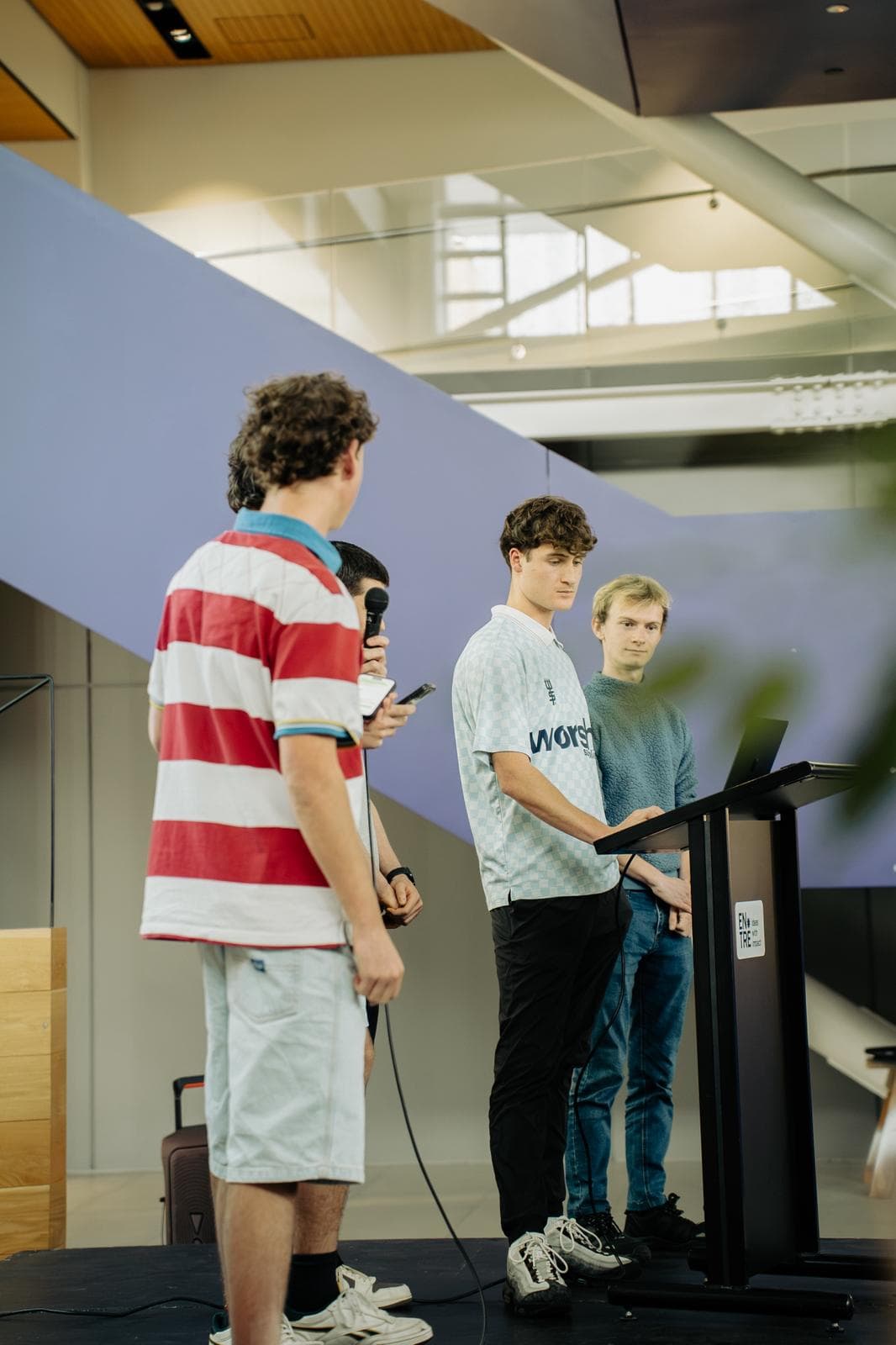 Young Kiwis in AI team pitching at the SaaSathon in Christchurch